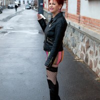 Sixty plus redhead Caroline Hamsel seduces a couple of dudes on the street in slutty clothes